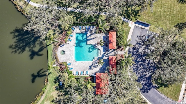 birds eye view of property with a water view