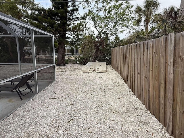 view of yard with a lanai and a patio