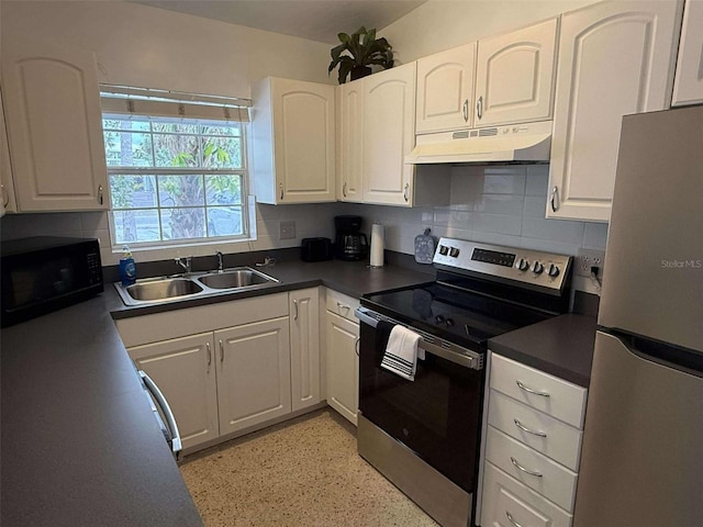 kitchen featuring white cabinetry, sink, backsplash, and appliances with stainless steel finishes