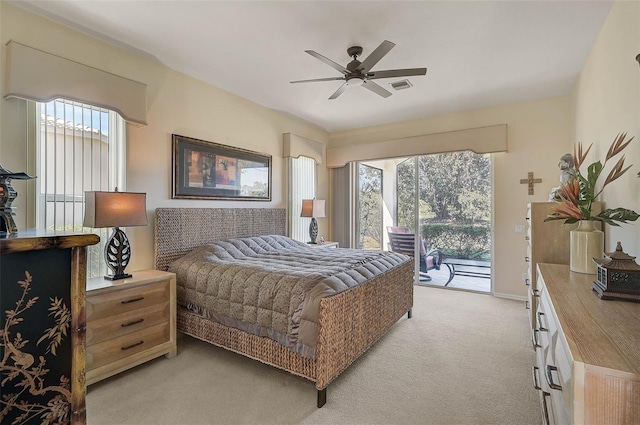 carpeted bedroom with ceiling fan and access to outside