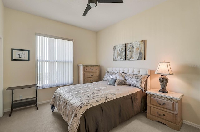 bedroom featuring light colored carpet and ceiling fan