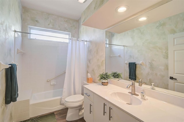 full bathroom featuring vanity, shower / tub combo, hardwood / wood-style floors, and toilet