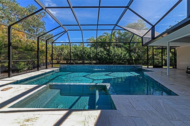 view of swimming pool featuring a patio area and glass enclosure