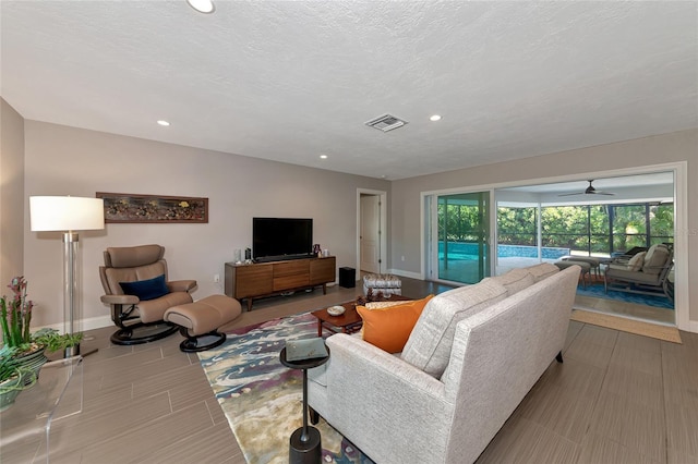 living room with a textured ceiling