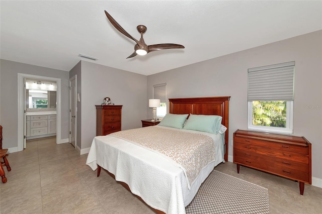 bedroom featuring connected bathroom and ceiling fan