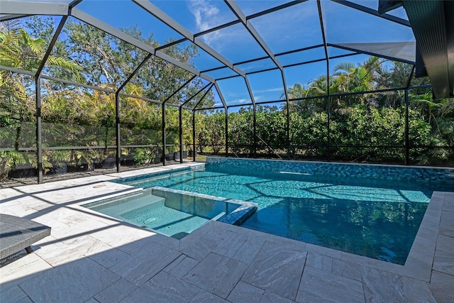 view of swimming pool featuring a patio, an in ground hot tub, and glass enclosure