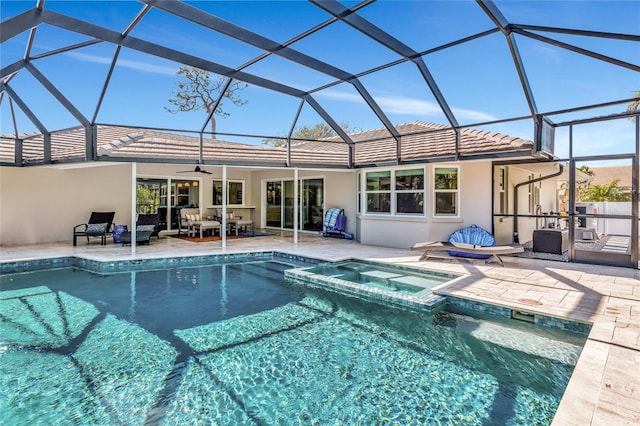 view of pool featuring an in ground hot tub, a patio, and a lanai