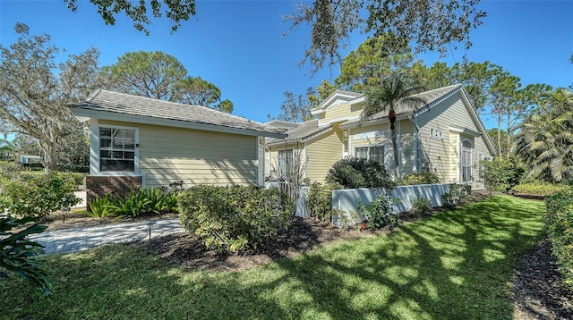 view of property exterior featuring a yard