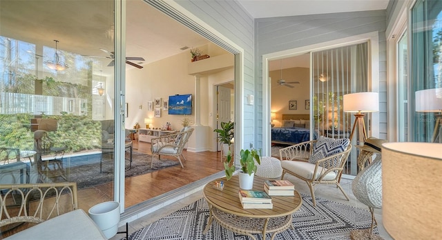 sunroom featuring ceiling fan