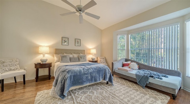 bedroom featuring lofted ceiling, hardwood / wood-style floors, and ceiling fan