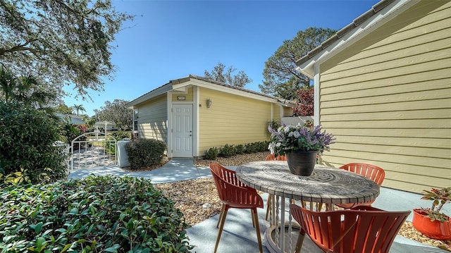 view of patio / terrace featuring an outbuilding