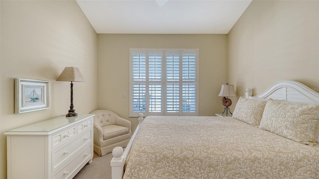 bedroom with light colored carpet