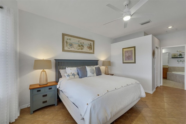 bedroom featuring ceiling fan, ensuite bath, and light tile patterned floors