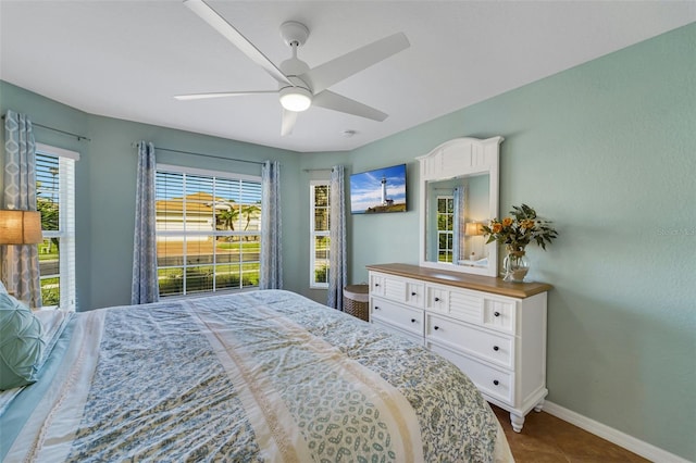 tiled bedroom with ceiling fan