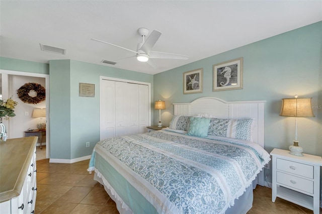 tiled bedroom featuring a closet and ceiling fan