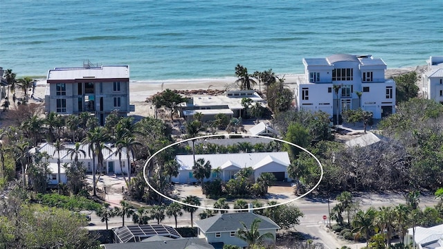 drone / aerial view featuring a view of the beach and a water view