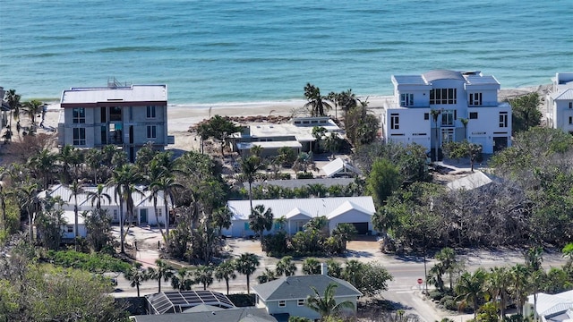 birds eye view of property featuring a water view and a view of the beach