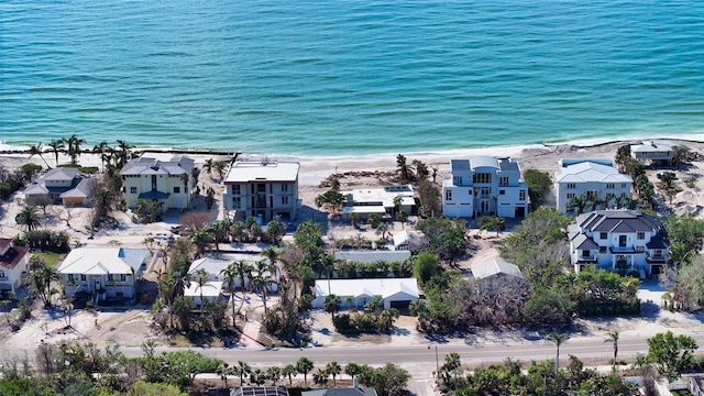 aerial view featuring a water view and a beach view