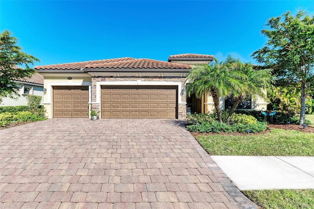 mediterranean / spanish-style house with a garage