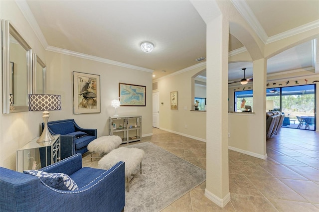 living room featuring light tile patterned floors, crown molding, and ceiling fan