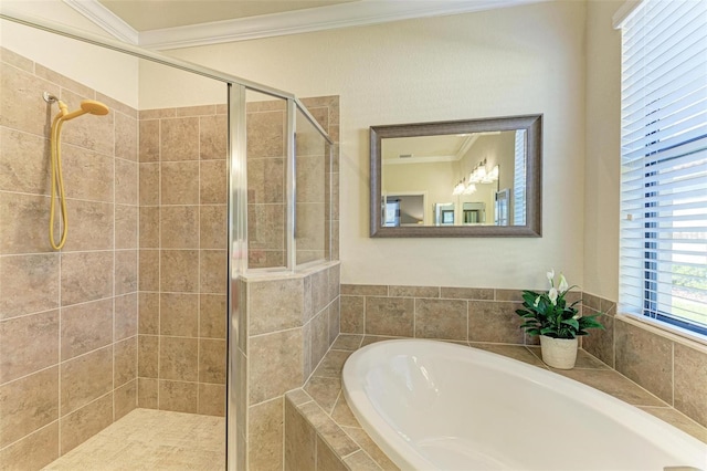 bathroom featuring ornamental molding and separate shower and tub