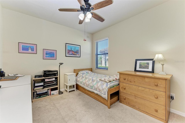 bedroom featuring ceiling fan and light carpet