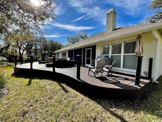 rear view of house featuring outdoor lounge area and a yard