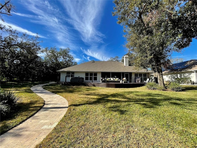 view of front of property with a front lawn