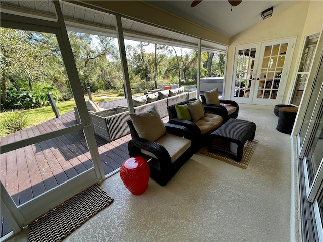 sunroom / solarium with french doors, ceiling fan, and vaulted ceiling