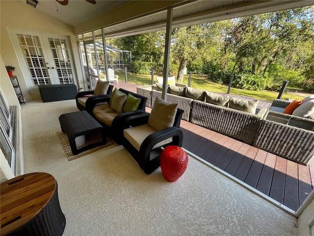 exterior space featuring lofted ceiling, ceiling fan, and french doors