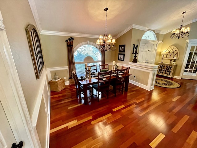dining room featuring dark hardwood / wood-style flooring, a notable chandelier, and crown molding