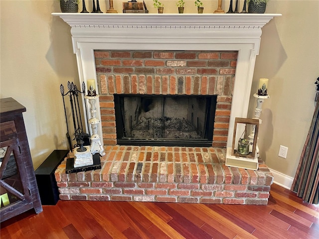 interior details with hardwood / wood-style flooring and a fireplace