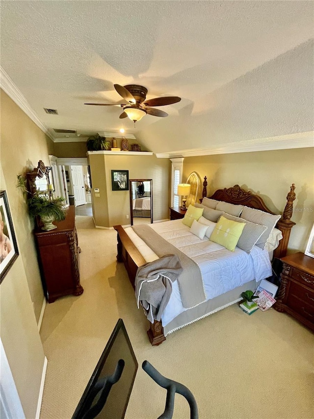 bedroom featuring lofted ceiling, a textured ceiling, ornamental molding, carpet flooring, and ceiling fan