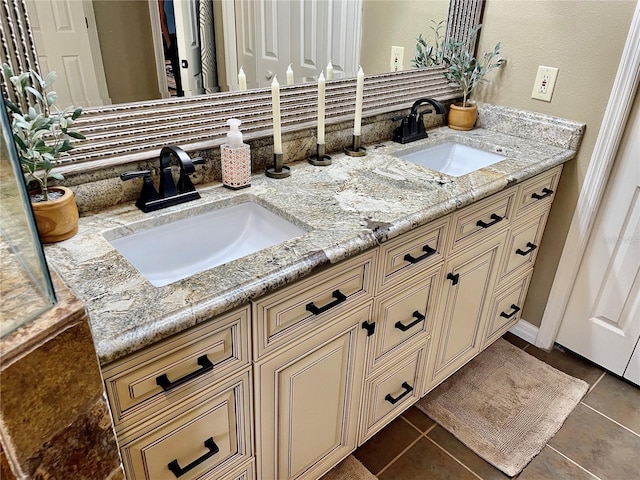 bathroom featuring tile patterned flooring and vanity