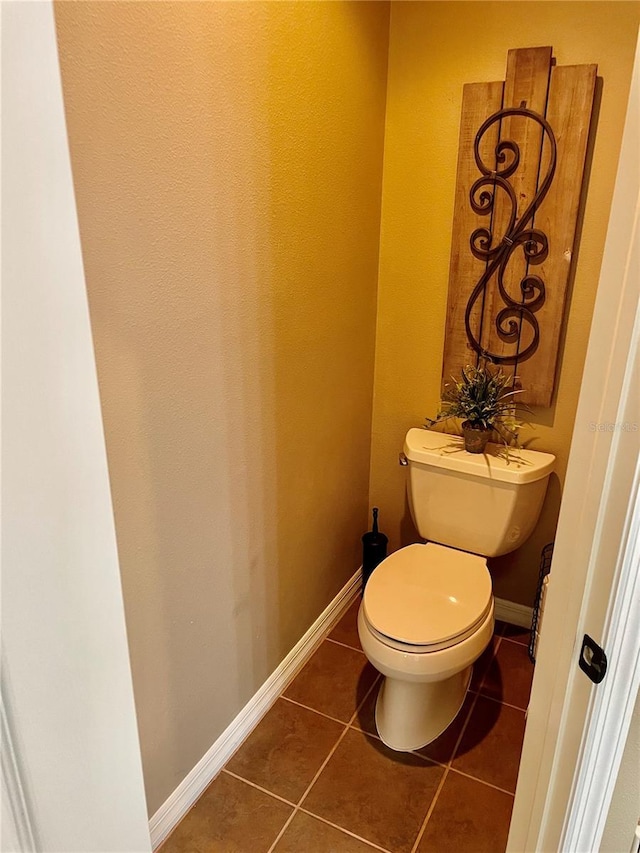 bathroom featuring tile patterned floors and toilet