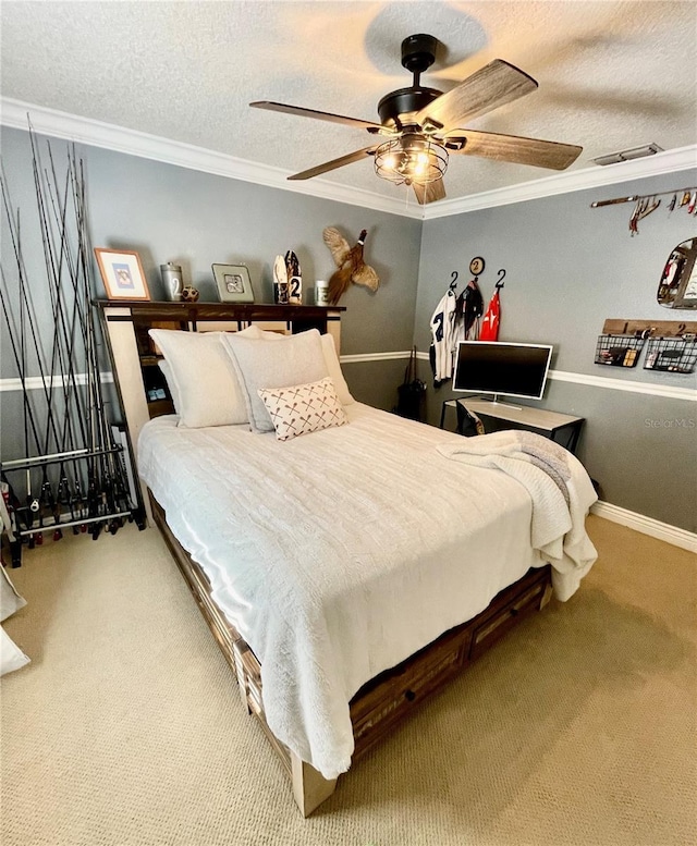 bedroom with ceiling fan, ornamental molding, carpet flooring, and a textured ceiling