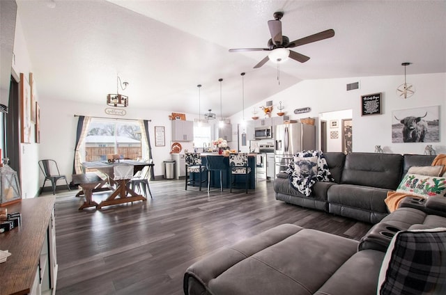 living room with lofted ceiling, dark hardwood / wood-style flooring, and ceiling fan