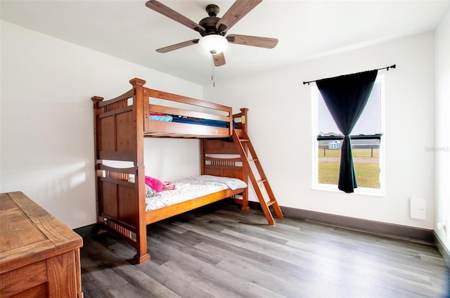 bedroom with ceiling fan and hardwood / wood-style floors