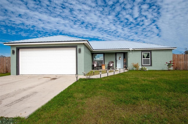 ranch-style house featuring a garage and a front lawn