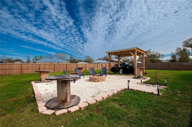 view of yard with an outdoor fire pit