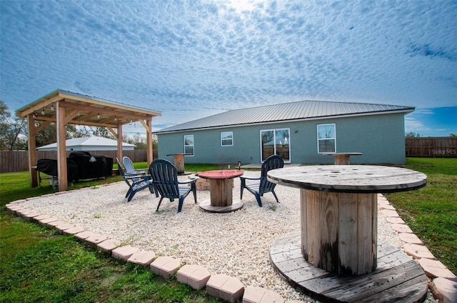 view of patio / terrace featuring an outdoor fire pit