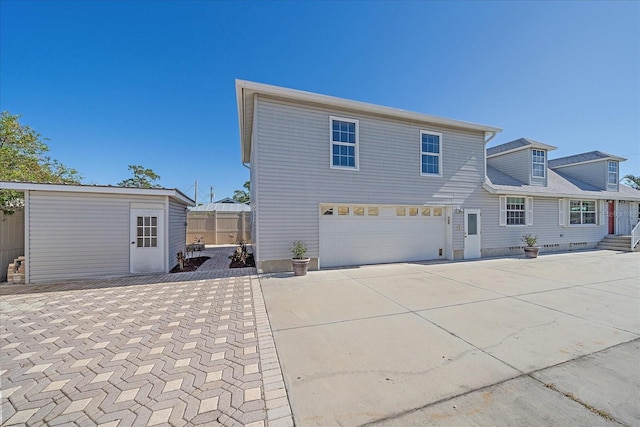 back of house with a garage