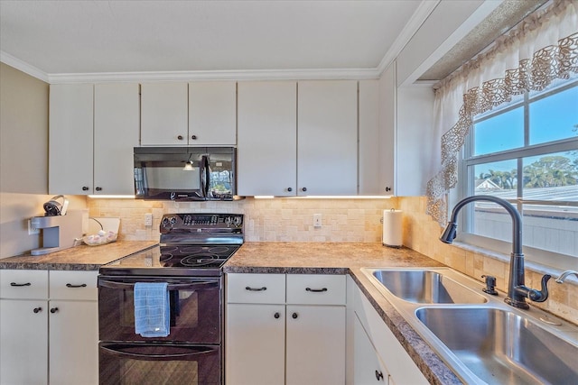 kitchen with ornamental molding, sink, white cabinets, and black appliances