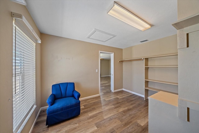 sitting room featuring wood-type flooring