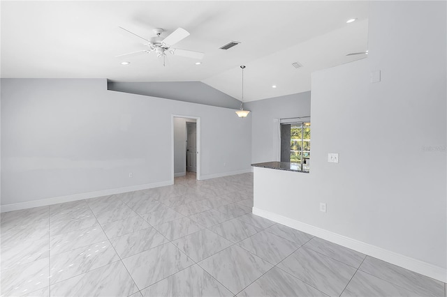 empty room featuring vaulted ceiling and ceiling fan