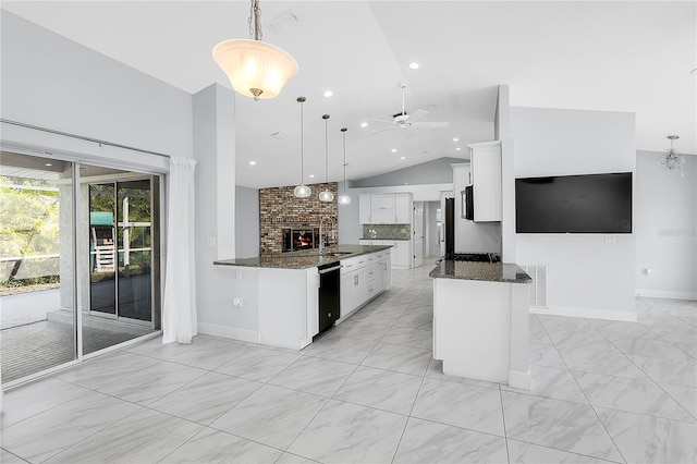 kitchen featuring pendant lighting, ceiling fan, dishwasher, white cabinetry, and kitchen peninsula