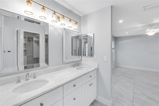 bathroom featuring ceiling fan and vanity