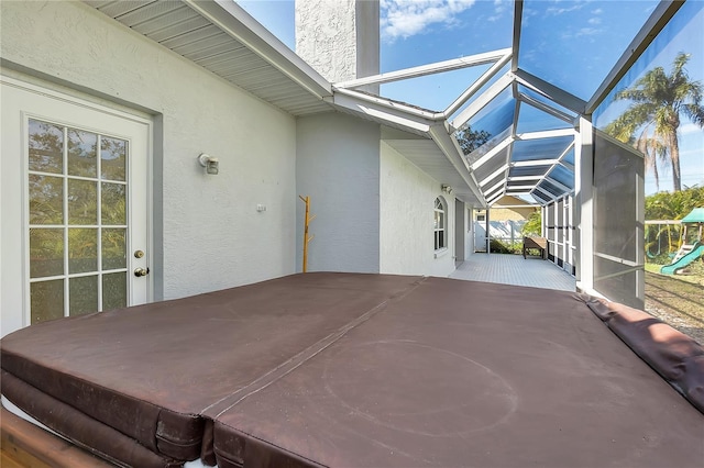 view of patio / terrace featuring a lanai and a playground