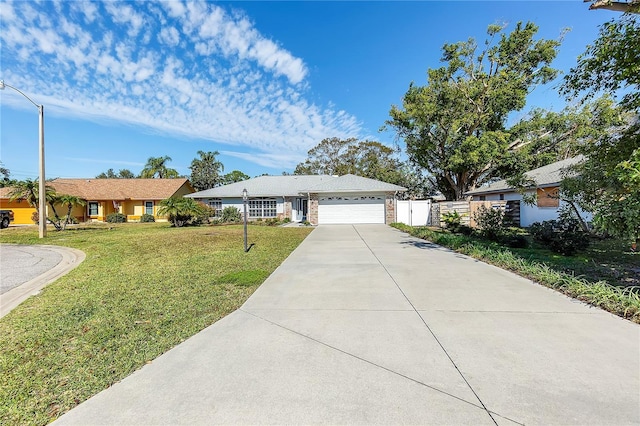 ranch-style house with a garage and a front yard