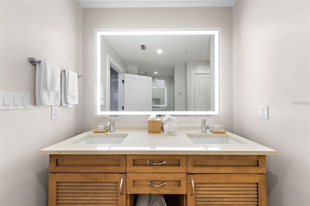 bathroom featuring vanity and a shower with shower door